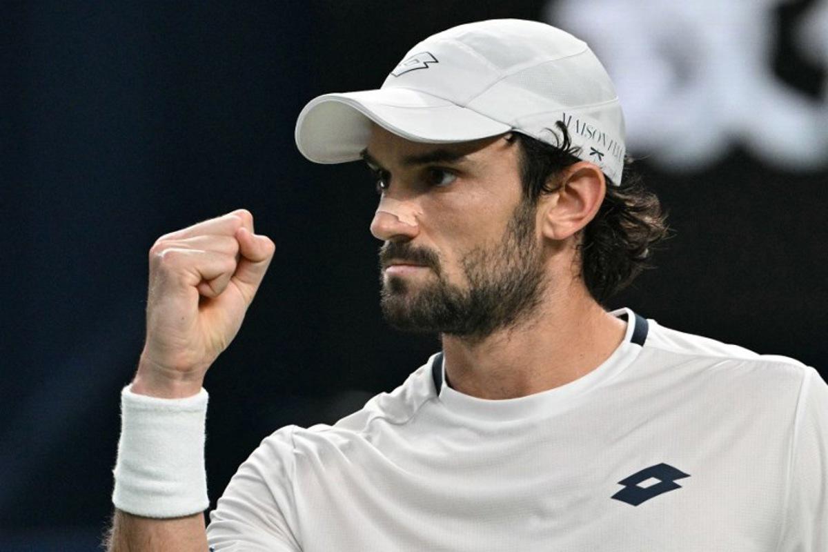 Monaco's Valentin Vacherot reacts after a point against France's Arthur Rinderknech during the men's singles final at the Shanghai Masters tennis tournament in Shanghai on October 12, 2025.  HECTOR RETAMAL / AFP