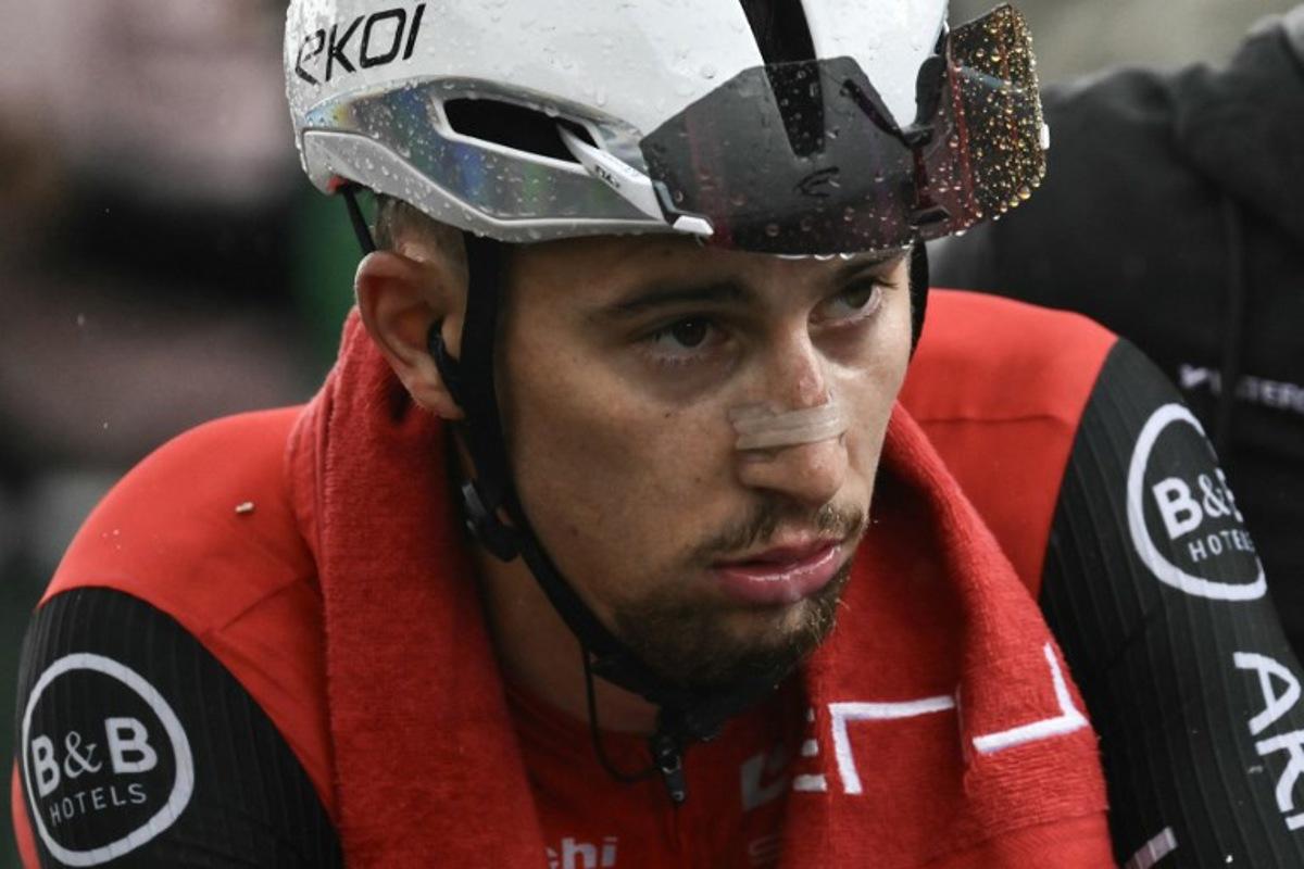 Arkea-B&B Hotels team's French rider Kevin Vauquelin looks on after the 19th stage of the 112th edition of the Tour de France cycling race, 93.1 km between Albertville and La Plagne, in the French Alps, on July 25, 2025. The 19th stage of the Tour de France was shorted from its initial 129.9 km route, bypassing the Col des Saisies where an outbreak of nodular dermatitis in a herd of cattle was discovered, prompting organizers to modify the race route. Marco BERTORELLO / AFP
