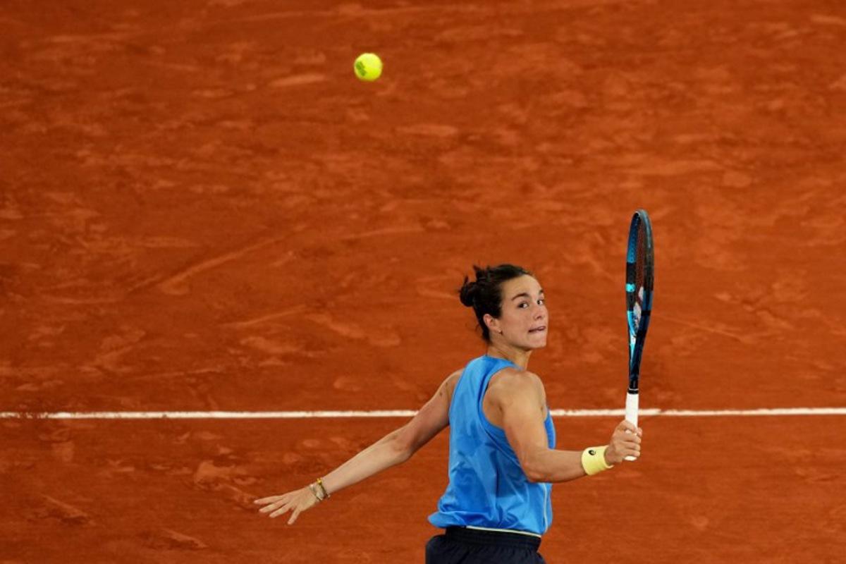 France's Lois Boisson eyes the ball as she plays against Russia's Mirra Andreeva during their women's singles quarter-final match on day 11 of the French Open tennis tournament on Court Philippe-Chatrier at the Roland-Garros Complex in Paris on June 4, 2025.  Dimitar DILKOFF / AFP