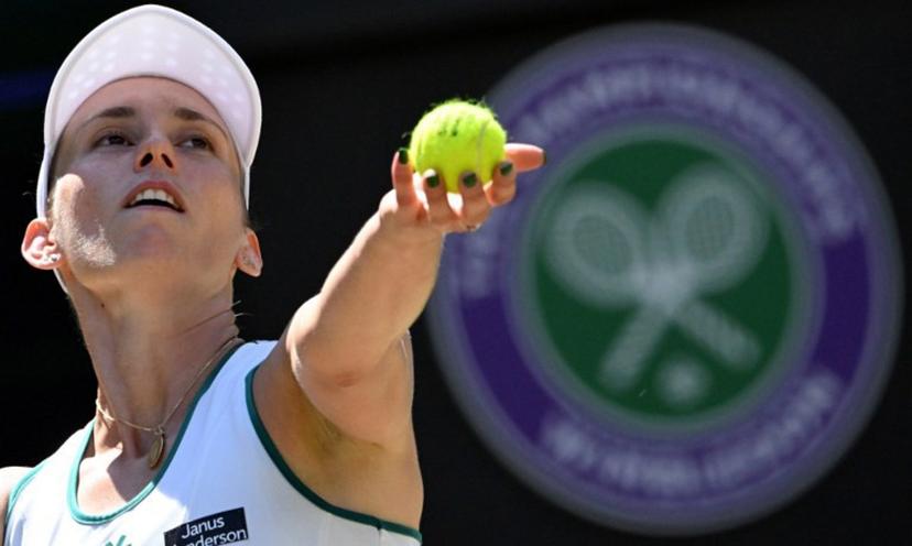 Belgium's Elise Mertens serves to Czech Republic's Linda Noskova during their women's singles quarter-final tennis match on the tenth day of the 2026 Wimbledon Championships at The All England Lawn Tennis and Croquet Club in Wimbledon, southwest London, on July 8, 2026.  Kirill KUDRYAVTSEV / AFP