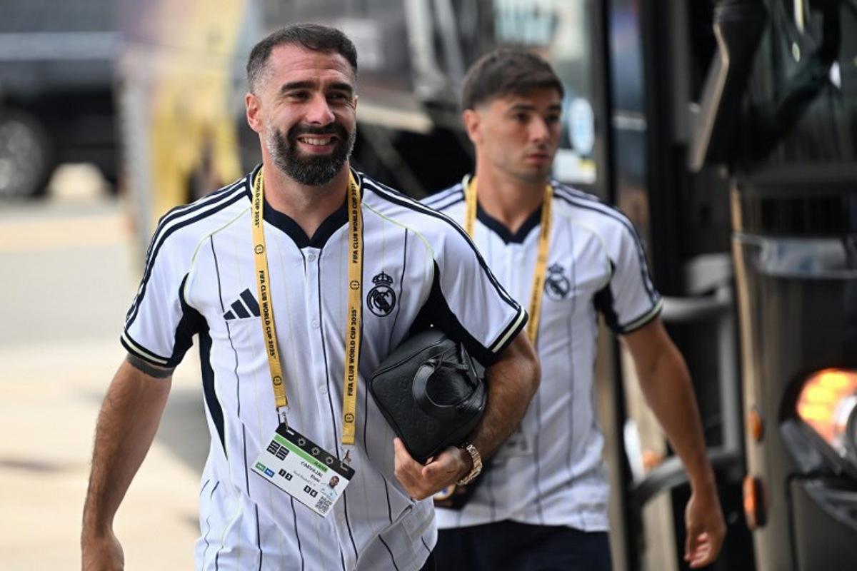 Real Madrid's Spanish defender #02 Dani Carvajal (L) arrives at the stadium ahead of the FIFA Club World Cup 2025 semifinal football match between France's Paris Saint-Germain and Spain's Real Madrid at the MetLife stadium in East Rutherford, New Jersey on July 9, 2025.  Paul ELLIS / AFP