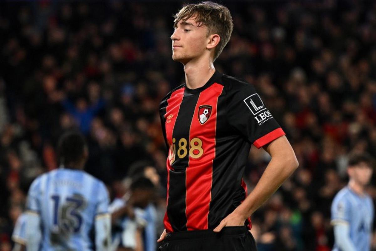 Bournemouth's Spanish defender #02 Dean Huijsen celebrates scoring the team's first goal during the English Premier League football match between Bournemouth and Tottenham Hotspur at the Vitality Stadium in Bournemouth, southern England on December 05, 2024.  JUSTIN TALLIS / AFP