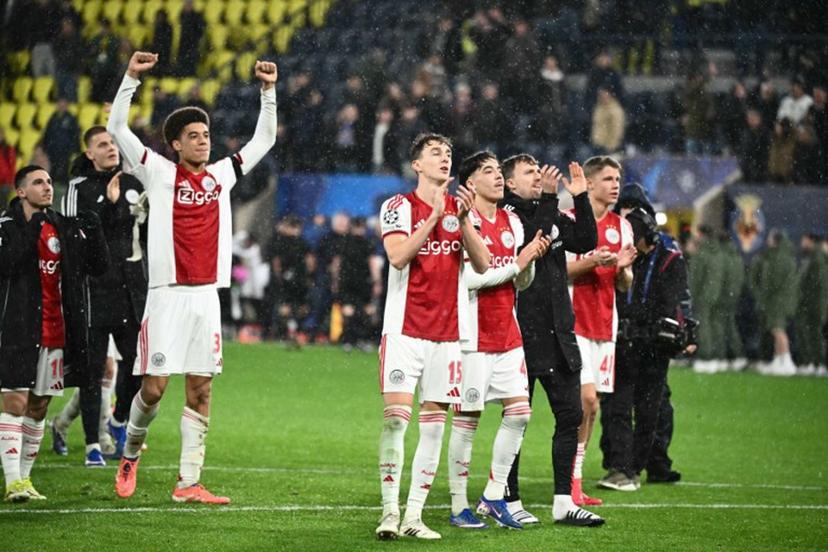 Ajax's Dutch defender #15 Youri Baas and teammates celebrate with supporters after winning the UEFA Champions League league phase day 7 football match between Villarreal CF and Ajax at La Ceramica Stadium in Vila-real on January 20, 2026.  JOSE JORDAN / AFP