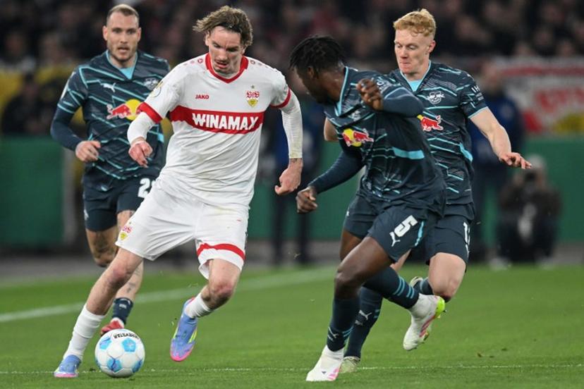Stuttgart's German forward #11 Nick Woltemade (L) and Leipzig's French defender #05 El Chadaille Bitshiabu vie for the ball during the German Cup (DFB Pokal) semi-final football match between VfB Stuttgart and RB Leipzig in Stuttgart, southwestern Germany on April 2, 2025.  THOMAS KIENZLE / AFP