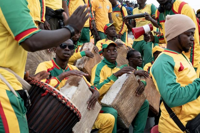 Lions of Senegal's supporters cheer during the Senegal's national football team last training session prior to the start of the 2025 Africa Cup of Nations hosted by Morocco, at the Leopaul Sedar Senghor stadium, in Dakar on December 18, 2025.  SEYLLOU / AFP