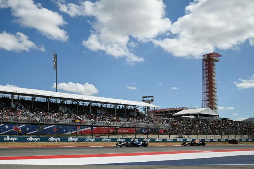 (L/R) Williams' Thai driver Alexander Albon and Red Bull Racing's Japanese driver Yuki Tsunoda race during the United States Formula One Sprint at the Circuit of the Americas in Austin, Texas, on October 18, 2025.  RONALDO SCHEMIDT / AFP