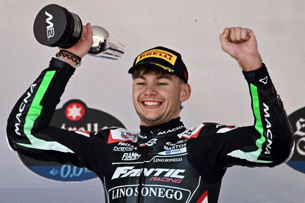 Second placed Fantic Racing's Belgian rider Barry Baltus celebrates on the podium after the Spanish Moto2 Grand Prix at the Jerez racetrack in Jerez de la Frontera, on April 27, 2025.  JAVIER SORIANO / AFP