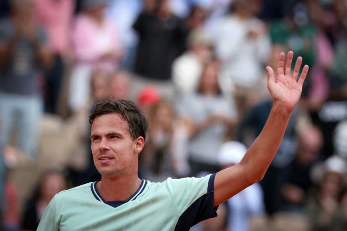 Germany's Daniel Altmaier celebrates after winning his men's singles match against US Taylor Fritz on day 2 of the French Open tennis tournament on Court Simonne-Mathieu at the Roland-Garros Complex in Paris on May 26, 2025.  Alain JOCARD / AFP