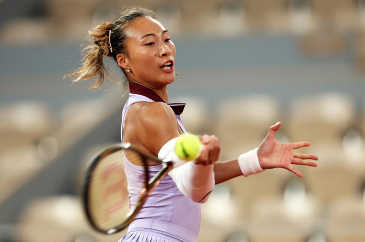 China's Zheng Qinwen plays a forehand return to Russia's Anastasia Pavlyuchenkova during their women's singles match on day 1 of the French Open tennis tournament on Court Philippe-Chatrier at the Roland-Garros Complex in Paris on May 25, 2025.  Alain JOCARD / AFP