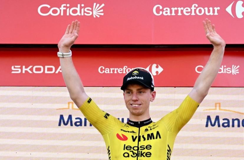 Team Visma-Lease a bike's British rider Matthew Brennan celebrates on the podium after winning the second stage of the Vuelta a Espana 2026, a 214,3 km race between Monaco and Manosque on August 23, 2026.  Miguel MEDINA / AFP