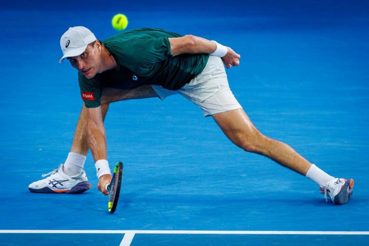 Belgium's Raphael Collignon hits a shot against USA's Brandon Nakashima during their men's singles match at the Brisbane International tennis tournament in Brisbane on January 9, 2026.  Patrick HAMILTON / AFP