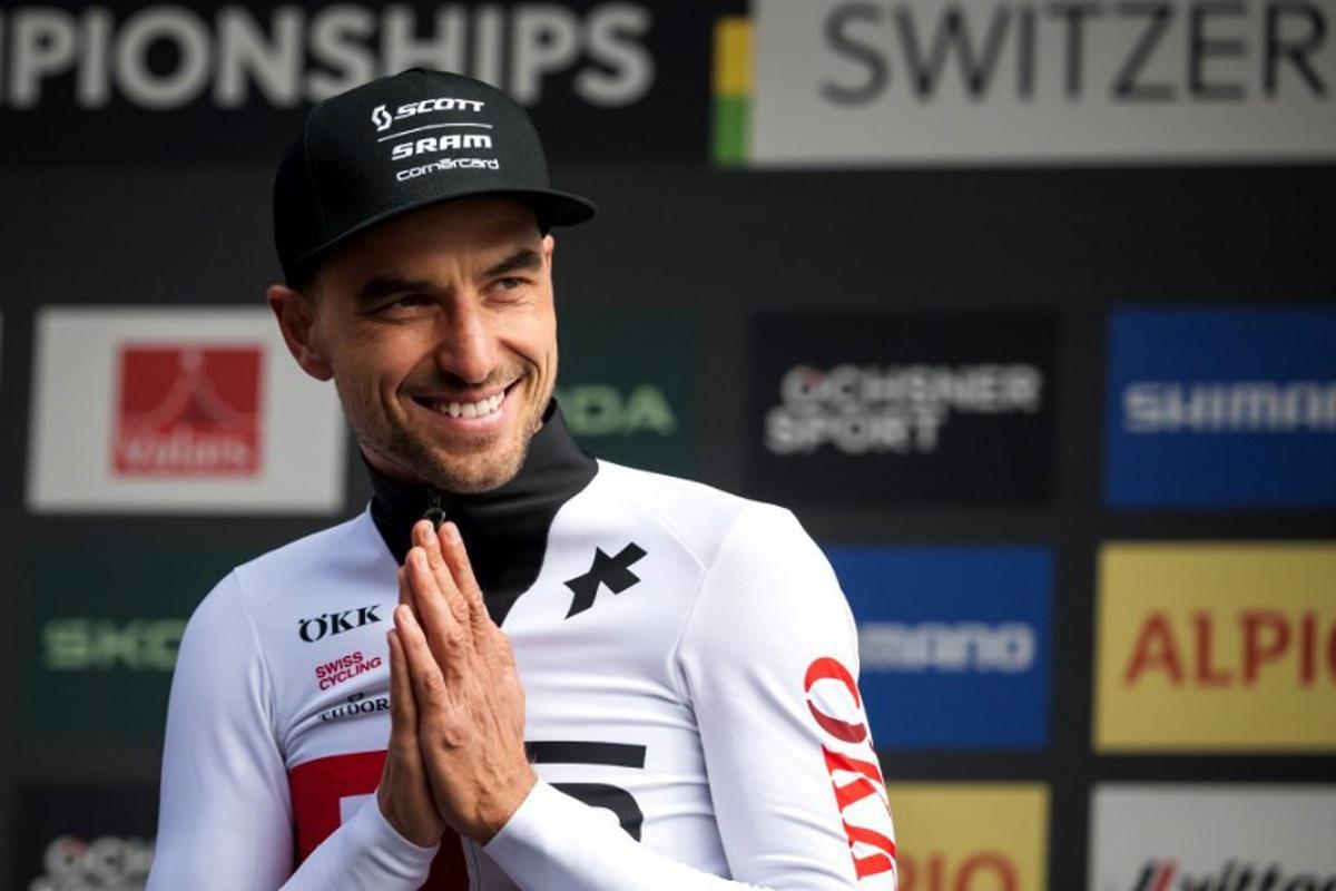Former Olympic and multiple World champion, Switzerland's Nino Schurter reacts after his last World Championships event on the podium of the Men's elite Cross-country Olympic race as part of the 2025 UCI Mountain Bike World Championships in Crans-Montana on September 14, 2025.  Fabrice COFFRINI / AFP