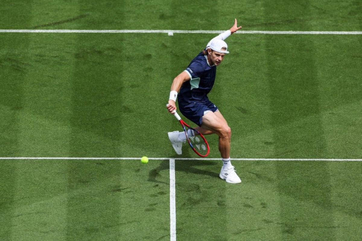 Belgium's Zizou Bergs plays a forehand return to Brazil's Joao Fonseca during their men's singles tennis match on day one at the Lexus Eastbourne International tennis tournament in Eastbourne, southern England, on June 23, 2025.  Adrian Dennis / AFP