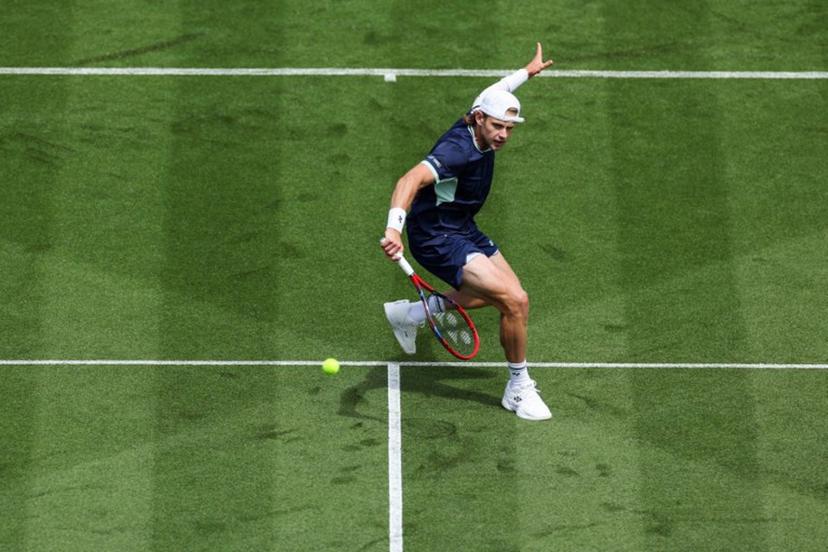 Belgium's Zizou Bergs plays a forehand return to Brazil's Joao Fonseca during their men's singles tennis match on day one at the Lexus Eastbourne International tennis tournament in Eastbourne, southern England, on June 23, 2025.  Adrian Dennis / AFP