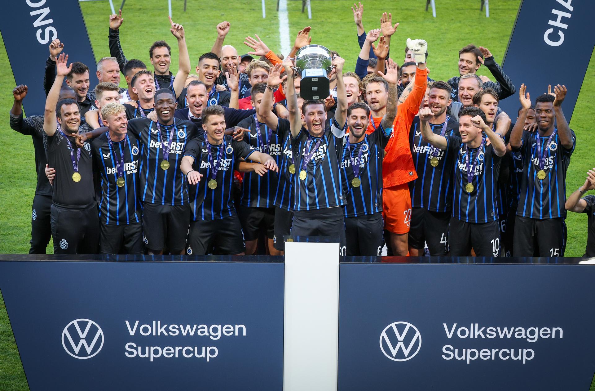 Club's players celebrate on the podium after winning a soccer match between Royale Union Saint-Gilloise and Club Brugge KV, Sunday 20 July 2025 in Brussels, the 'Super Cup' where the Champions of the Jupiler Pro League Brugge meets the winner of the Croky Cup Union. BELGA PHOTO VIRGINIE LEFOUR