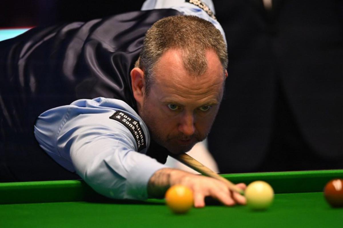 Wales' Mark Williams plays a shot during the Masters snooker tournament final against England's Judd Trump at Alexandra Palace in London on January 15, 2023.  JUSTIN TALLIS / AFP