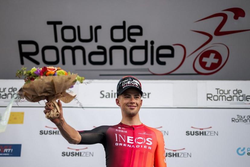 Great Britain's Samuel Watson (Ineos) celebrates his victory during the podium ceremony for the prologue of the Tour of Romandie UCI cycling World tour, a 3.4 km time trial from Saint-Imier to Saint-Imier, on April 29, 2025.  Fabrice COFFRINI / AFP