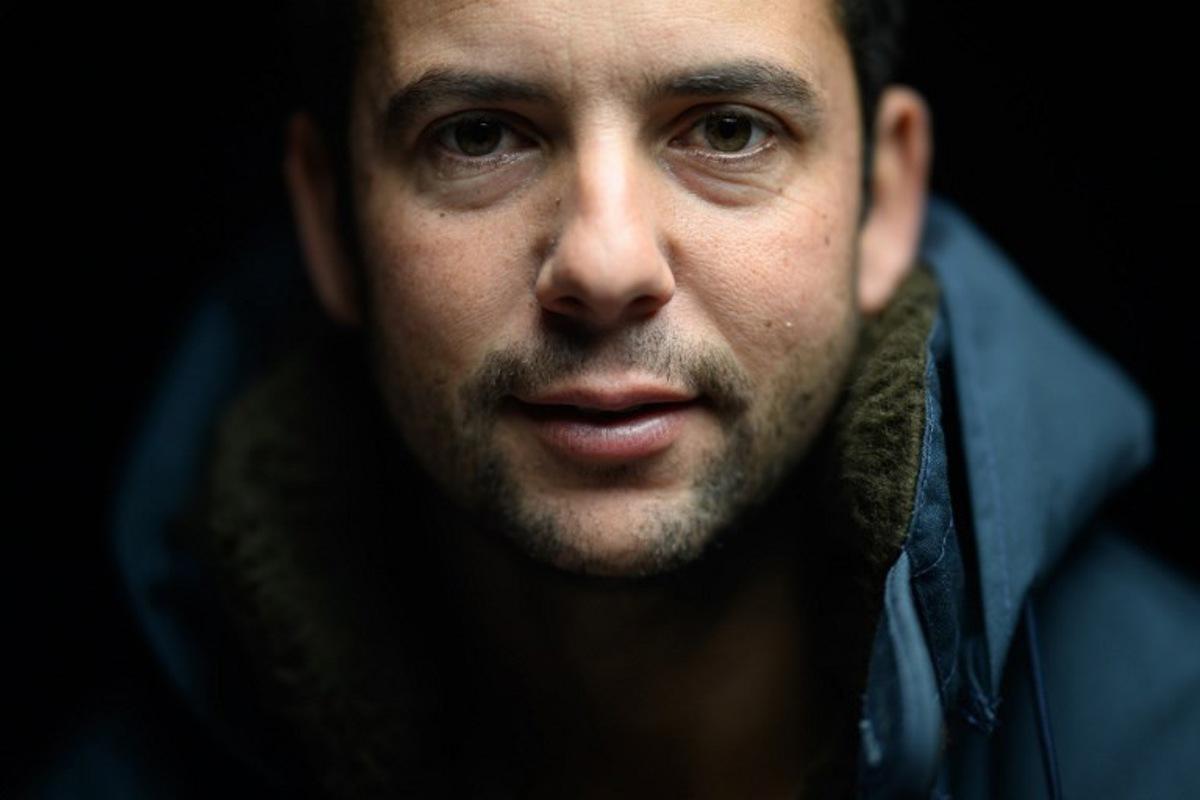French skipper Guirec Soudee poses aboard his Imoca 60 "Freelance.com" at the Vendee Globe village ahead of the 10th edition of the Vendee Globe around the world monohull solo sailing race, in Les Sables-d'Olonne, western France on November 7, 2024. The 10th Vendee Globe will depart from Les Sables d'Olonne, western France, on November 10, 2024. Loic VENANCE / AFP