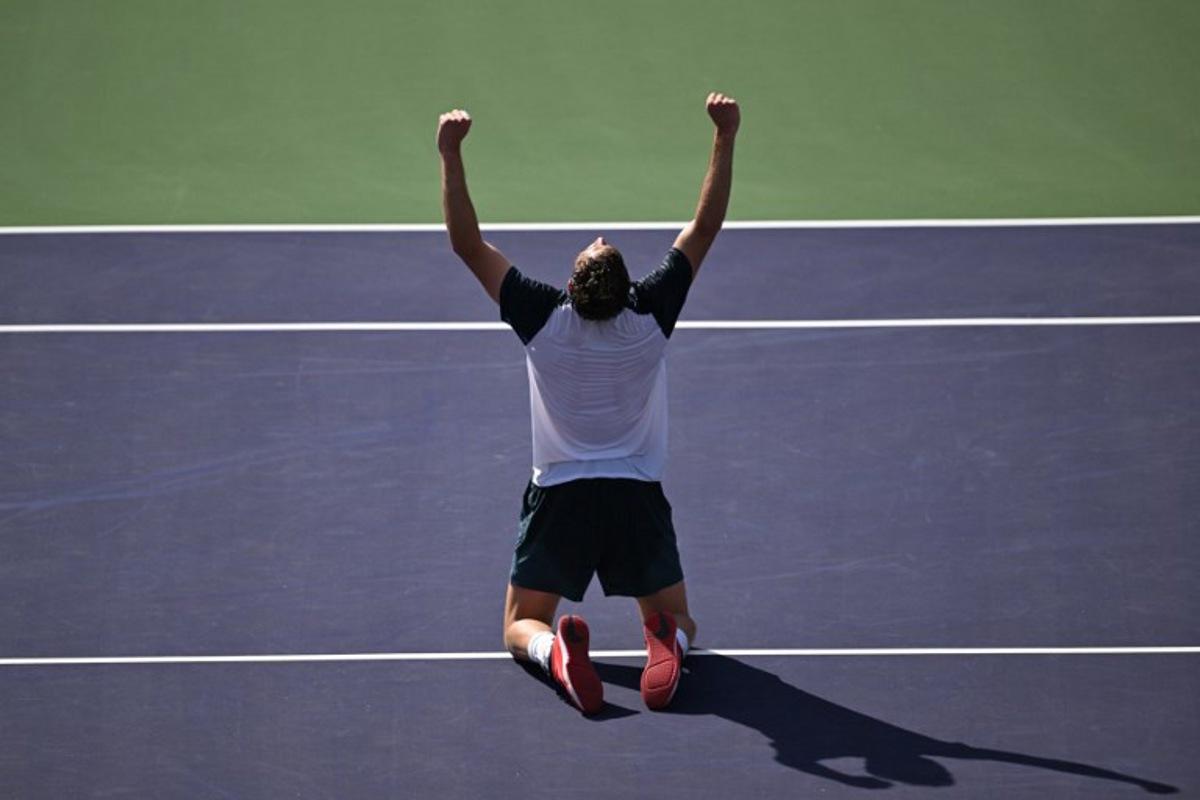 Britain's Jack Draper celebrates after defeating Denmark's Holger Rune during the men's singles final tennis match at the BNP Paribas Open at the Indian Wells Tennis Garden in Indian Wells, California, on March 16, 2025.  Patrick T. Fallon / AFP