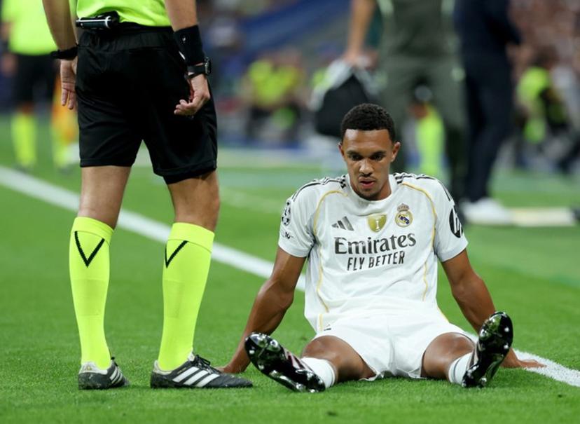Real Madrid's English defender #12 Trent Alexander-Arnold reacts on the ground after suffering an injury during the UEFA Champions League first round day 1 football match between Real Madrid CF and Olympique de Marseille at the Santiago Bernabeu stadium in Madrid on September 16, 2025.  Thomas COEX / AFP