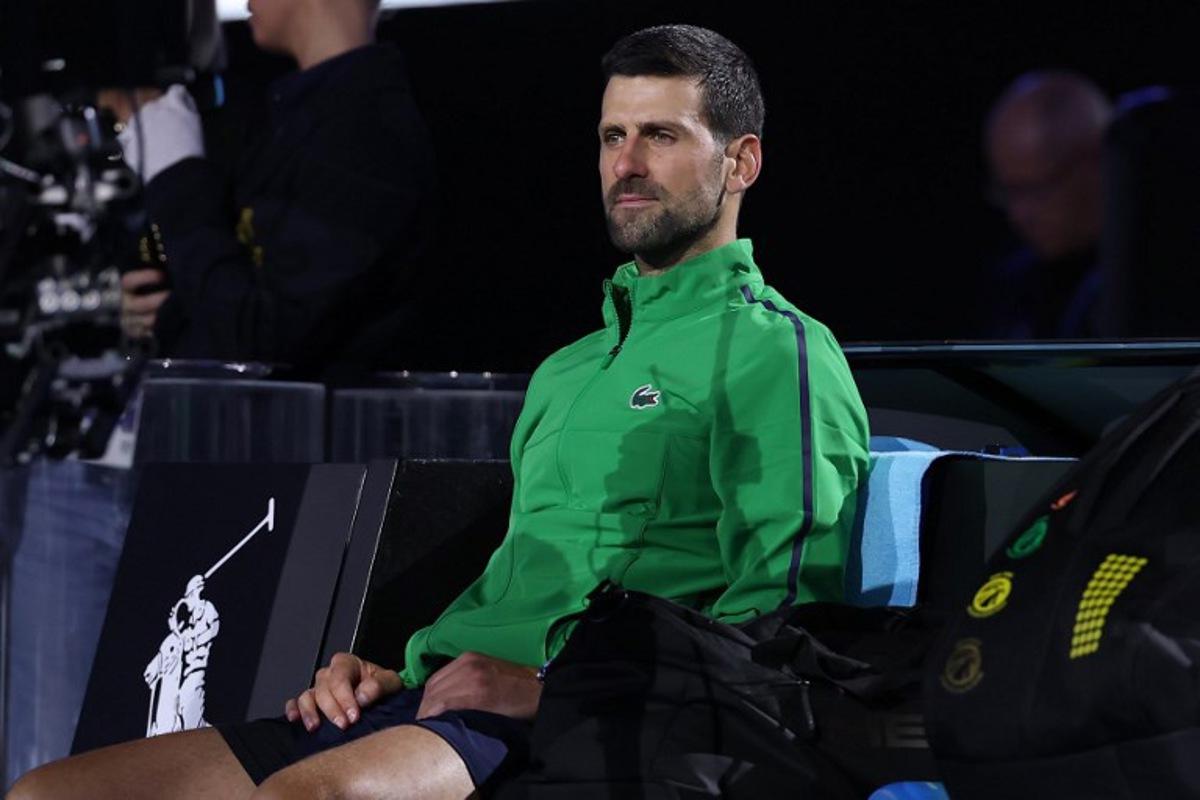 Serbia's Novak Djokovic looks on after his loss to Spain's Carlos Alcaraz during their men's singles final match on day fifteen of the Australian Open tennis tournament in Melbourne on February 1, 2026.  Martin KEEP / AFP