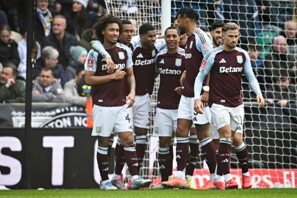 Aston Villa's English striker #09 Marcus Rashford (C) celebrates with teammates after scoring his team second goal during the English FA Cup quarter-final football match between Preston North End and Aston Villa at Deepdale stadium in Preston, north-west England on March 30, 2025.  Paul ELLIS / AFP