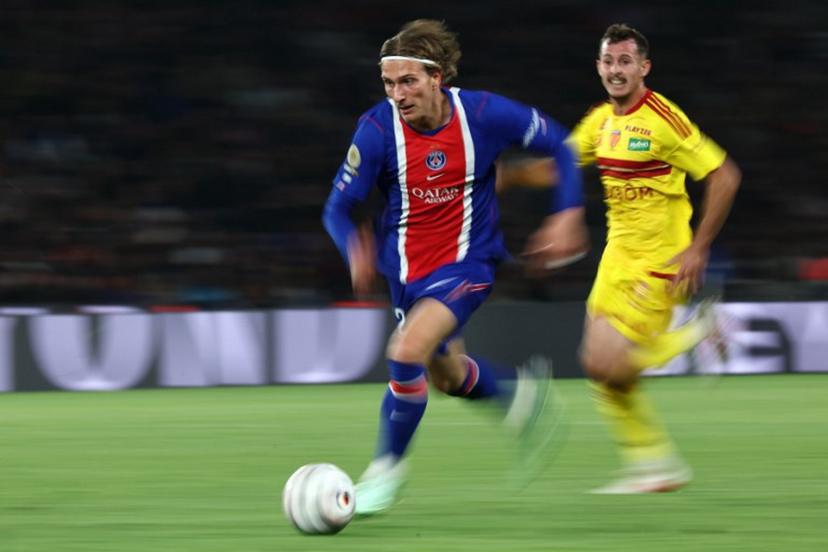 PSG's Belgian forward #22 Mika Godts runs with the ball during the French L1 football match between Paris Saint-Germain (PSG) and Le Mans FC at the Parc des Princes stadium in Paris on October 10, 2026.  FRANCK FIFE / AFP