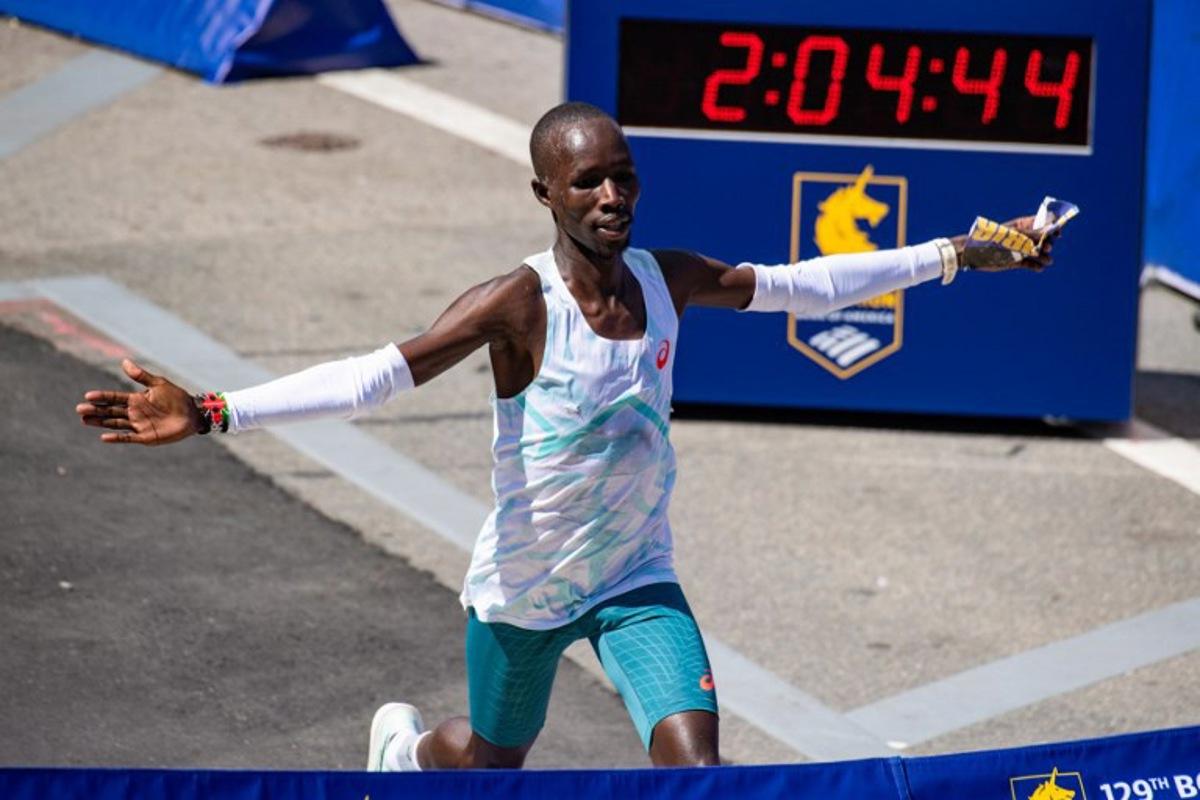 Kenyan distance runner John Korir crosses the finish line as he wins the men's race during the 129th Boston Marathon on April 21, 2025, in Boston, Massachusetts.  The marathon includes around 30,000 athletes from 129 countries running the 26.2 miles from Hopkinton to Boston, Massachusetts.  The event is the world's oldest annually run marathon.  Joseph Prezioso / AFP