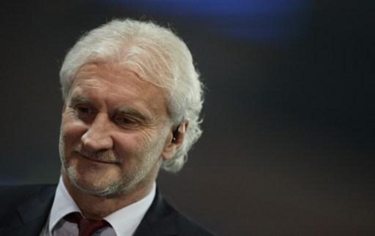 Former German international Rudi Voller stands on the pitch prior to the UEFA Champions League last 16 second-leg football match between Paris Saint Germain and Bayer Leverkusen on March 12, 2014 in Paris.  AFP PHOTO / FRANCK FIFE