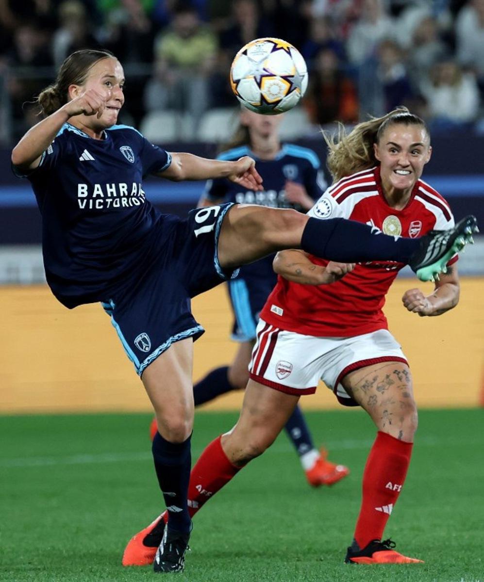 Paris FC's French defender #19 Thea Gheboval (L) and Arsenal's English midfielder #04 Georgia Stanway (r) fight for the ball during the UEFA Women's Champions League league phase Matchday 2 football match between Paris FC and Arsenal WFC at the Jean-Bouin Stadium in Paris on September 30, 2026.  FRANCK FIFE / AFP