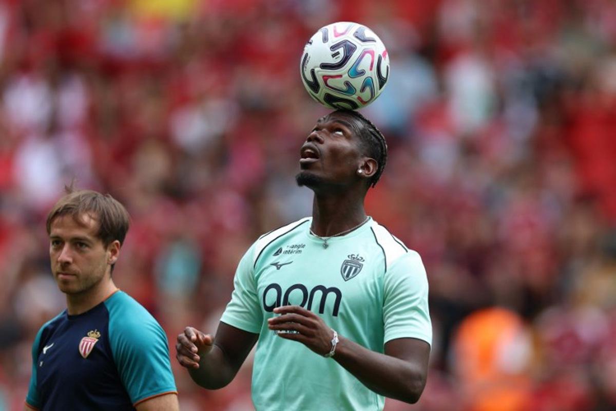 Monaco's French midfielder #08 Paul Pogba on the pitch ahead of the pre-season friendly football match between Liverpool and Monaco at Anfield in Liverpool, north west England on August 9, 2026.  Darren Staples / AFP