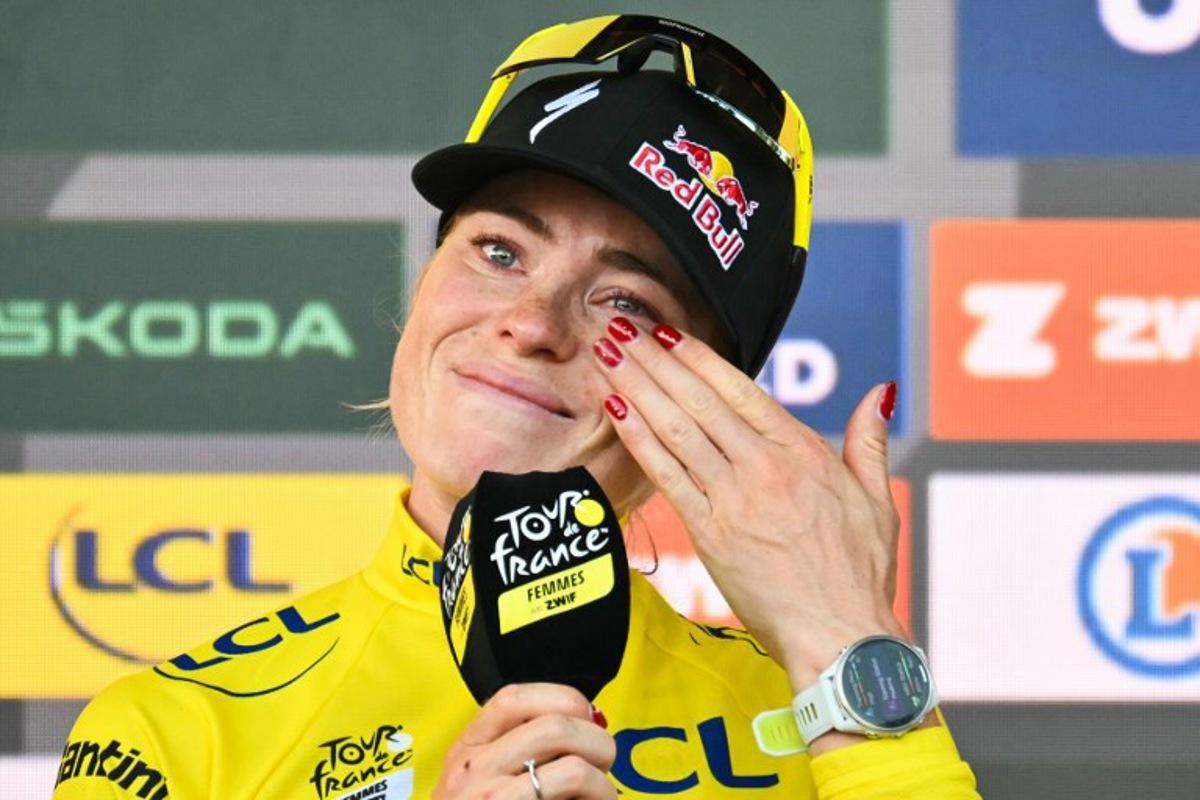 FDJ-SUEZ's Dutch rider Demi Vollering reacts on the podium after winning the 9th and final stage of the fifth edition of the Women's Tour de France cycling race, 99.2 km from Nice to Nice, southeastern France on August 9, 2026.  NICOLAS TUCAT / AFP