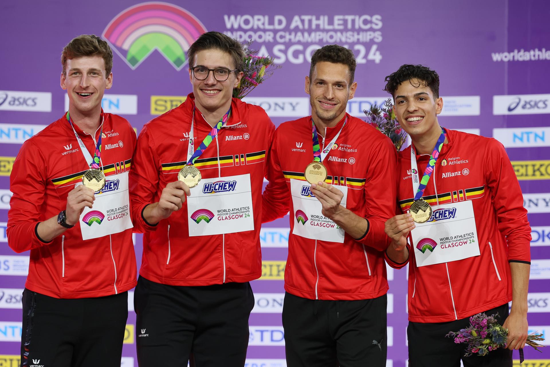 Belgian Alexander Doom, Belgian Christian Iguacel, Belgian Dylan Borlee and Belgian Jonathan Sacoor , winners of the gold medal celebrate on the podium of the final of the men's 4x400m relay event, on day three of the World Athletics Indoor Championships in Glasgow, Scotland, UK, on Sunday 03 March 2024. The Worlds are taking place from 01 to 03 March 2024. BELGA PHOTO BENOIT DOPPAGNE