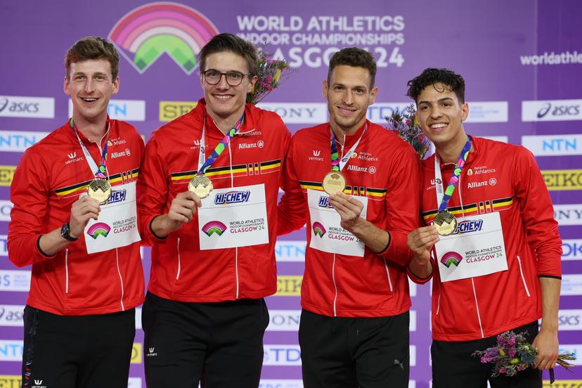 Belgian Alexander Doom, Belgian Christian Iguacel, Belgian Dylan Borlee and Belgian Jonathan Sacoor , winners of the gold medal celebrate on the podium of the final of the men's 4x400m relay event, on day three of the World Athletics Indoor Championships in Glasgow, Scotland, UK, on Sunday 03 March 2024. The Worlds are taking place from 01 to 03 March 2024. BELGA PHOTO BENOIT DOPPAGNE