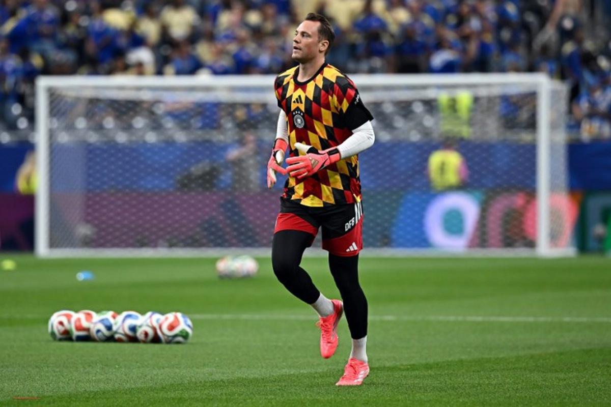 Germany's goalkeeper #01 Manuel Neuer takes part in the warm-up ahead of the 2026 World Cup Group E football match between Germany and Curacao at the Houston Stadium in Houston on June 14, 2026.    Paul ELLIS / AFP