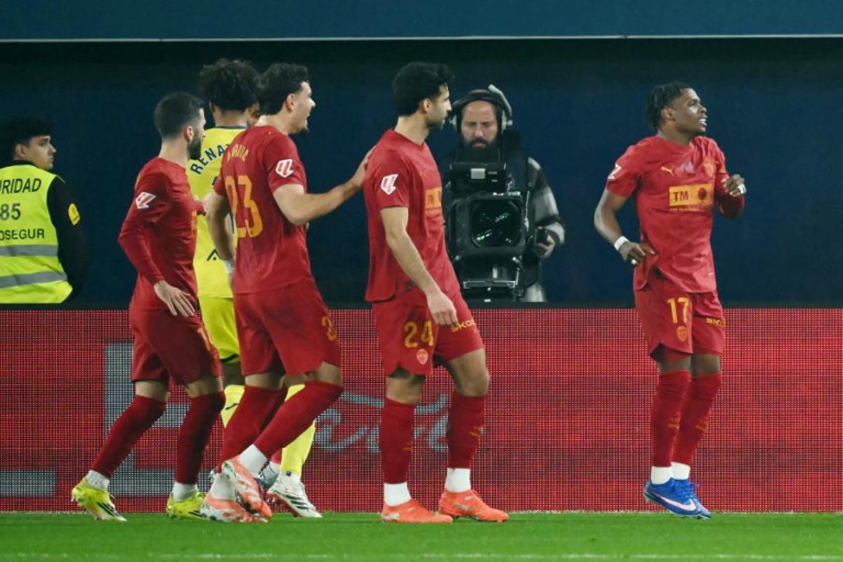 Valencia's Belgian forward # 17 Largie Ramazani celebrates after scoring the opening goal from the penalty spot during the Spanish league football match between Villarreal CF and Valencia CF at La Ceramica Stadium in Vila-real on February 22, 2026.  JOSE JORDAN / AFP