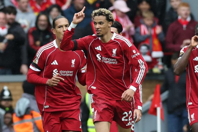 Liverpool's French striker #22 Hugo Ekitike (C) celebrates after scoring their second goal during the English Premier League football match between Liverpool and Everton at Anfield in Liverpool, north west England on September 20, 2025.  Darren Staples / AFP