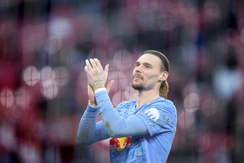Leipzig's Belgian goalkeeper #26 Maarten Vandevoordt celebrates after the Bundesliga football match between RB Leipzig and Augsburg in Leipzig, eastern Germany, on March 7, 2026.  Ronny HARTMANN / AFP