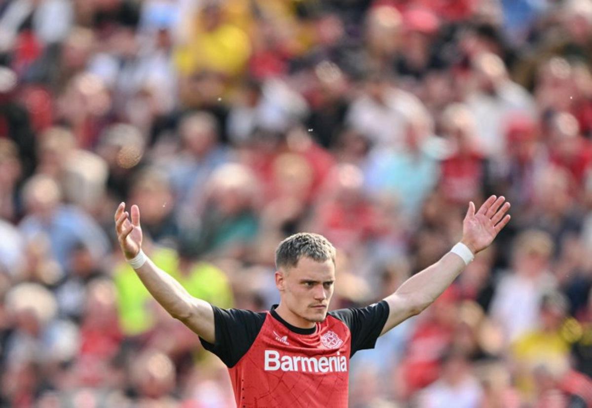 Bayer Leverkusen's German midfielder #10 Florian Wirtz reacts during the German first division Bundesliga football match between Bayer 04 Leverkusen and Borussia Dortmund in Leverkusen, western Germany, on May 11, 2025.  INA FASSBENDER / AFP
