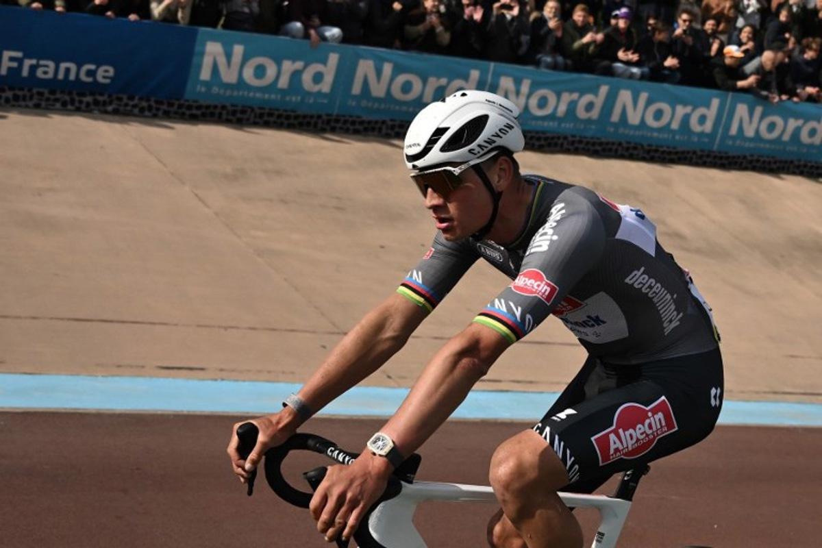 First placed Alpecin-Deceuninck's Dutch rider Mathieu van der Poel reacts after crossing the finish line to win the 122nd edition of the Paris-Roubaix one-day classic cycling race, 259,2 km between Compiegne and Roubaix, at the Vélodrome André-Pétrieux in Roubaix, northern France on April 13, 2025.  Jeff PACHOUD / POOL / AFP