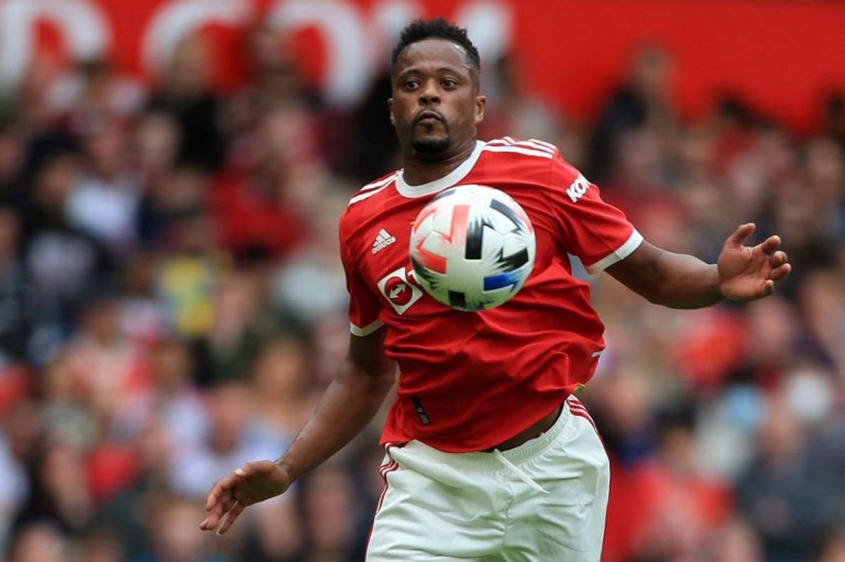 Manchester United's Patrice Evra controls the ball during the Legends of the North football match between Manchester United Legends and Liverpool Legends at Old Trafford in Manchester, north-west England on May 21, 2022.  Lindsey Parnaby / AFP