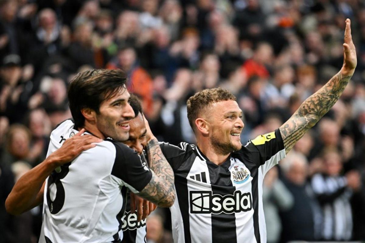 Newcastle United's English midfielder #23 Jacob Murphy (C) celebrates with Newcastle United's English defender #02 Kieran Trippier (R) and Newcastle United's Italian midfielder #08 Sandro Tonali (L) after scoring his team first goal during the English Premier League football match between Newcastle United and Crystal Palace at St James' Park in Newcastle-upon-Tyne, north east England on April 16, 2025.  ANDY BUCHANAN / AFP