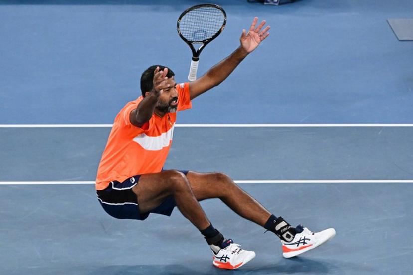 India's Rohan Bopanna celebrates after victory against Italy's Simone Bolelli and Andrea Vavassori during their men's doubles final match on day 14 of the Australian Open tennis tournament in Melbourne on January 27, 2024.  WILLIAM WEST / AFP