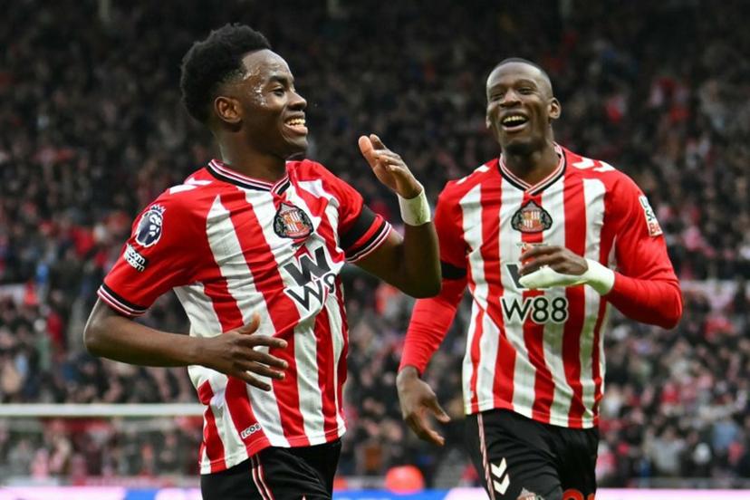 Sunderland's English Ivorian #24 Simon Adingra (L) celebrates after scoring the opening goal of the English Premier League football match between Sunderland and Leeds United at The Stadium of Light in Sunderland in north east England on December 28, 2025.  ANDY BUCHANAN / AFP