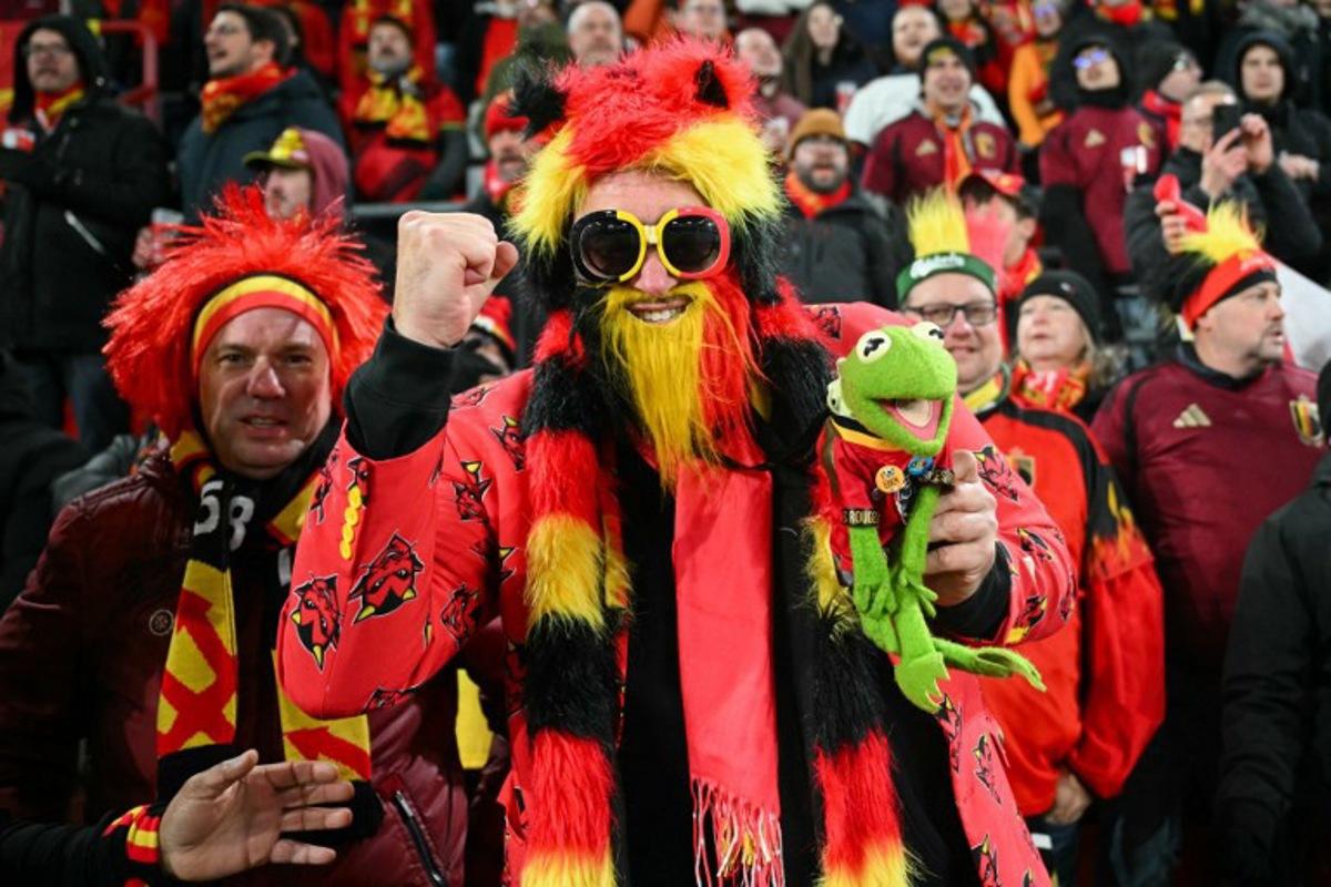 Belgian supporters cheer ahead of the FIFA World Cup 2026 Group J European qualification football match between Belgium and Liechtenstein at the Maurice-Dufrasne stadium, in Liege, on November 18, 2025.   NICOLAS TUCAT / AFP