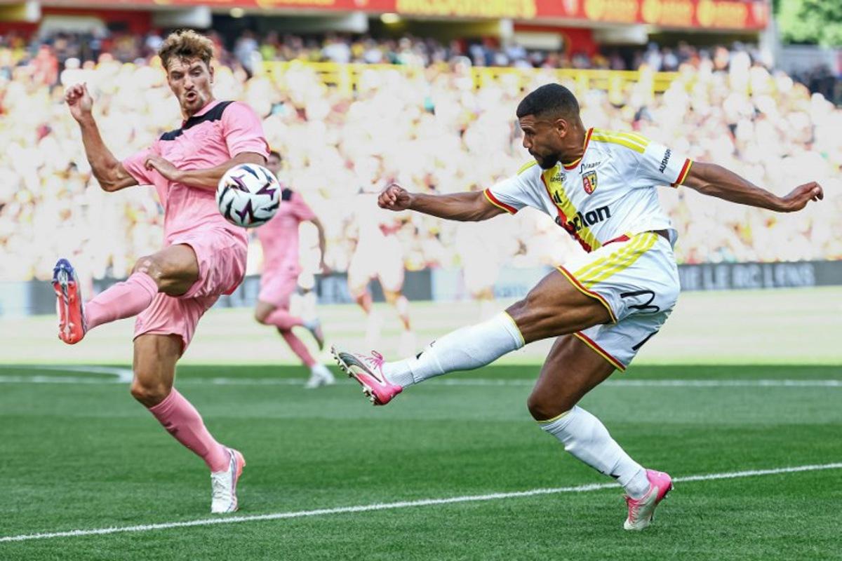 Lens' French defender Matthieu Udol (R) kicks the ball next to Sunderland's Belgian defender Thomas Meunier during a friendly football match between RC Lens and AFC Sunderland at the Bollaert-Delelis Stadium in Lens, northern France, on August 8, 2026.  Sameer Al-DOUMY / AFP