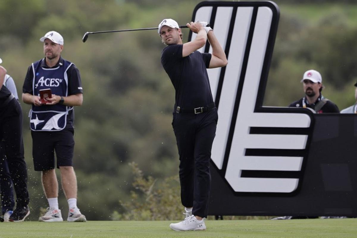 4Aces GC's Belgian player Thomas Detry watches a drive from the 14th tee on the fourth day of the LIV Golf South Africa tournament at The Club in Steyn City on March 22, 2026.  WIKUS DE WET / AFP