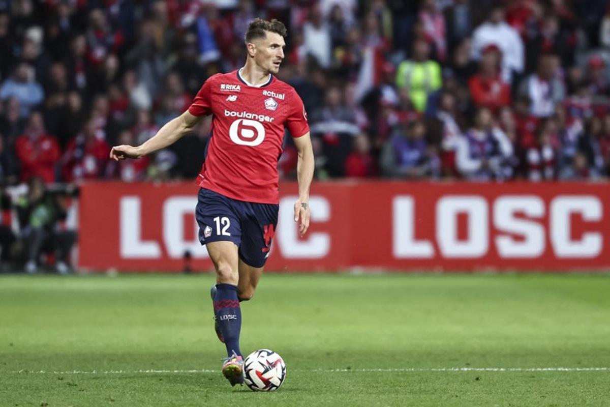 Lille's Belgian defender #12 Thomas Meunier runs with the ball during the French L1 football match between Lille (LOSC) and Olympique de Marseille (OM) at the Pierre-Mauroy stadium in Villeneuve-d'Ascq, northern France, on May 4, 2025.  Sameer Al-DOUMY / AFP