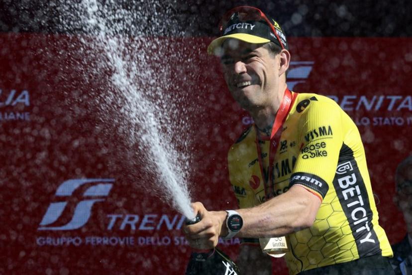 Team Visma-Lease a Bike's Belgian rider Wout Van Aert celebrates on the podium after winning the 9th stage of the 108th Giro d'Italia cycling race of 181kms from Gubbio to Siena on May 18, 2025.  Luca Bettini / AFP