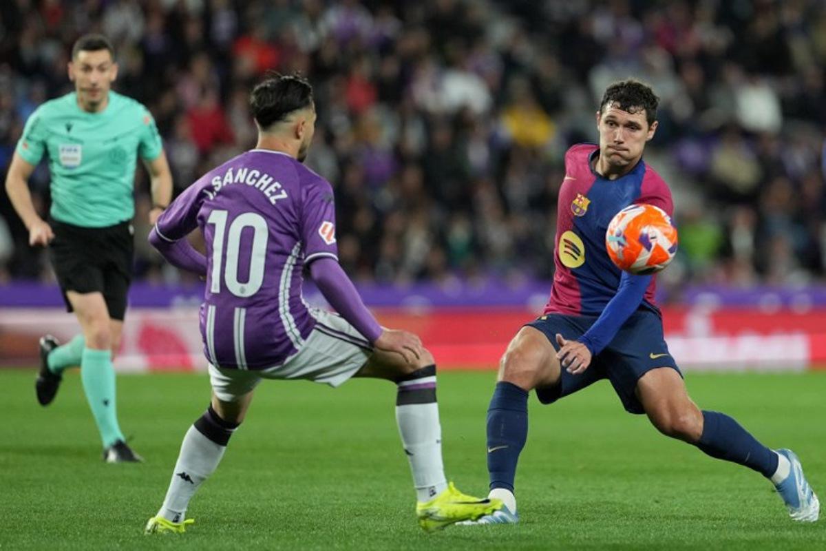 Real Valladolid's Spanish midfielder #10 Ivan Sanchez and Barcelona's Danish defender #15 Andreas Christensen vie for the ball during the Spanish league football match between Real Valladolid FC and FC Barcelona at the Jose Zorrilla stadium in Valladolid on May 3, 2025.  Cesar Manso / AFP